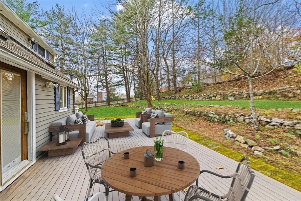 31 Doris Road Braintree, MA 02184 - Photo 3 of 20 a view of a patio with iron fence