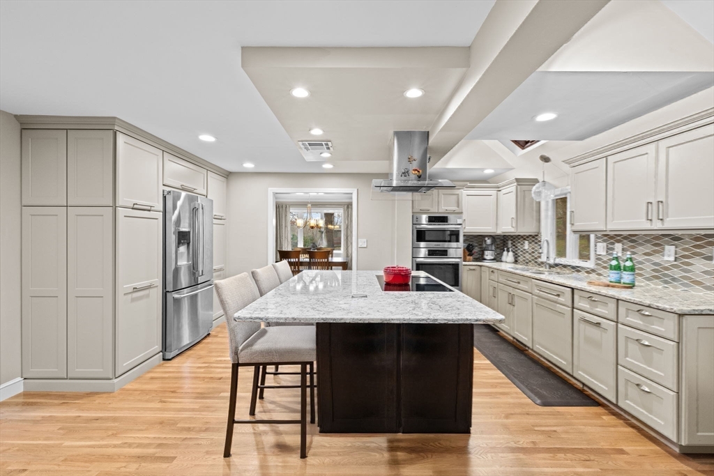 31 Doris Road Braintree, MA 02184 - Photo 5 of 20 a kitchen with stainless steel appliances granite countertop a refrigerator and a stove top oven
