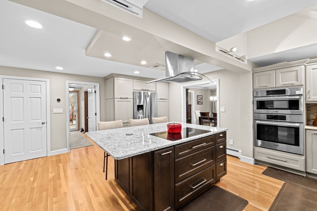 31 Doris Road Braintree, MA 02184 - Photo 7 of 20 a living room with stainless steel appliances furniture a rug kitchen view and a faucet