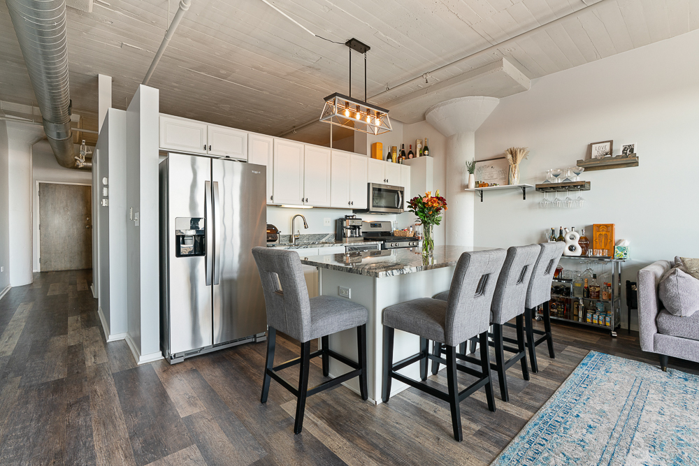 1525 South Sangamon Street, Unit 514 Chicago, IL 60608 - Photo 5 of 16 a view of dining room and wooden floor