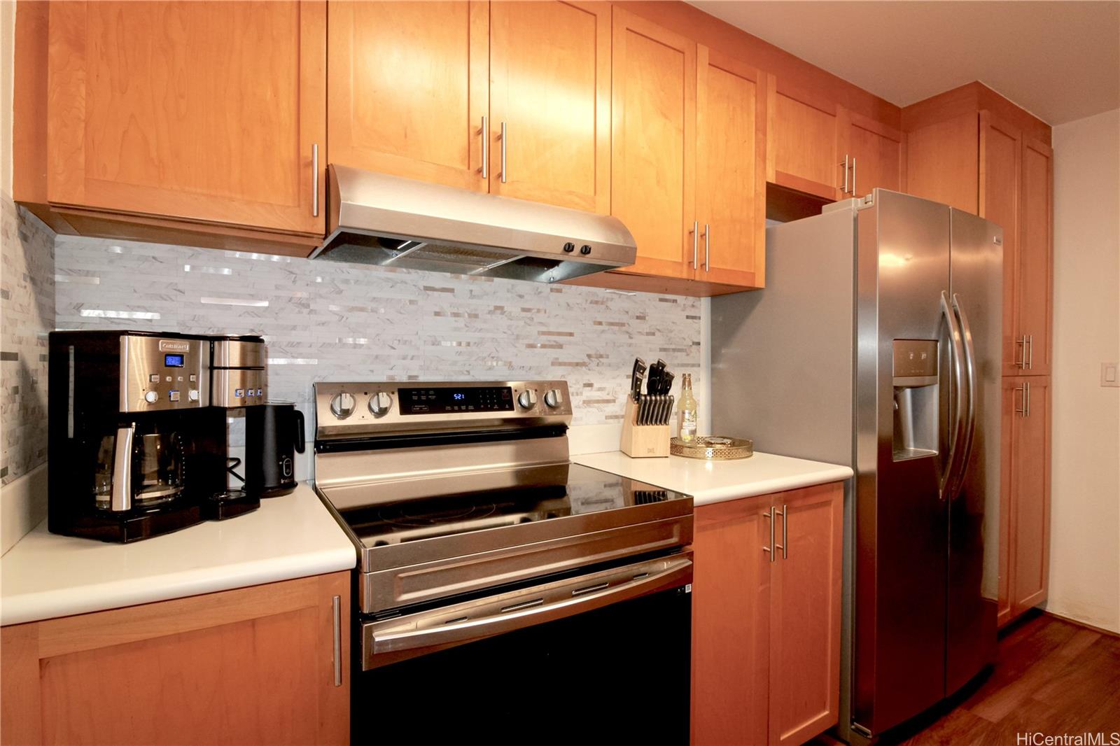 7080 Hawaii Kai Drive, Unit 8 Honolulu, HI 96825 - Photo 1 of 1 a kitchen with a stove and a refrigerator