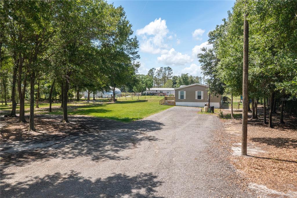 15079 Brahma Road Polk City, FL 33868 - Photo 36 of 40 a view of a park with swings and slides