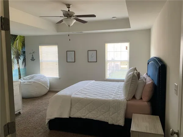 a bedroom with a bed and window