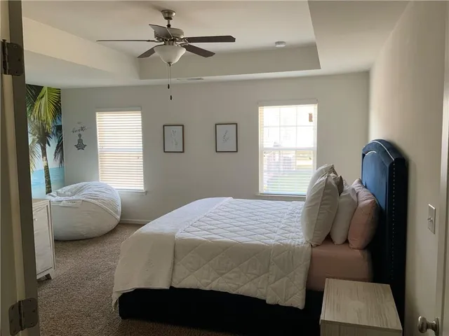 a bedroom with a bed and window
