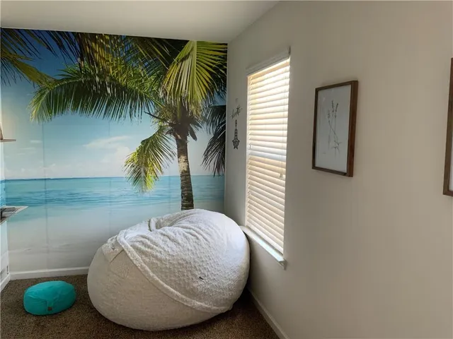 a view of a room with a potted plant