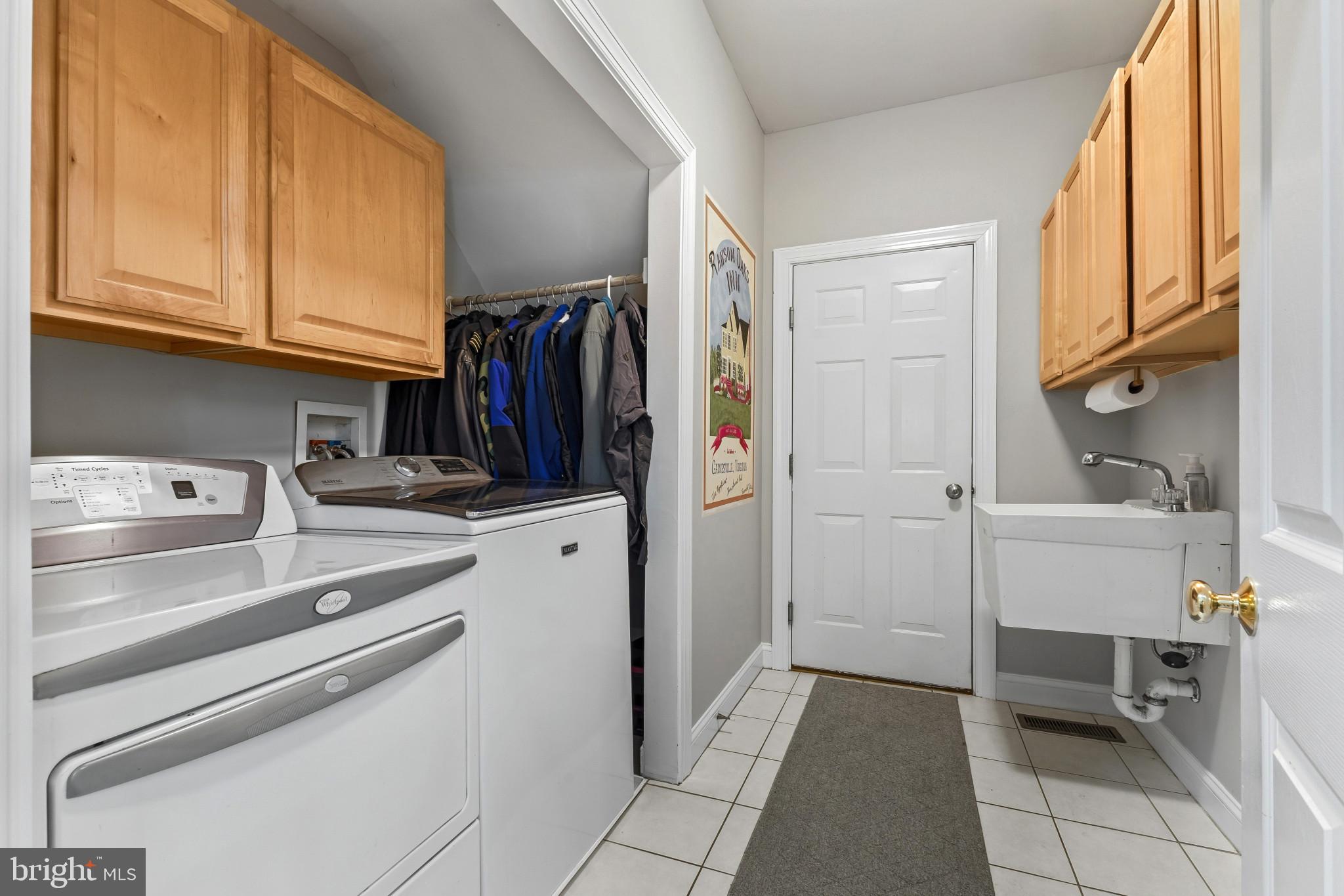 15006 Ransom Oaks Court Gainesville, VA 20155 - Photo 16 of 57 Functional laundry space with storage.