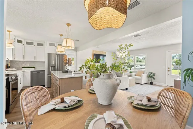 a kitchen with a stove and a white cabinets