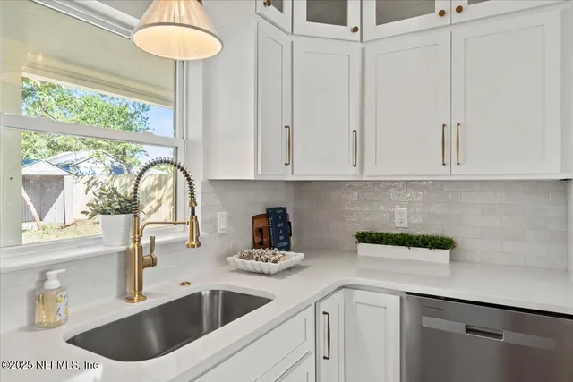 a bed room with a bed mirror and a window