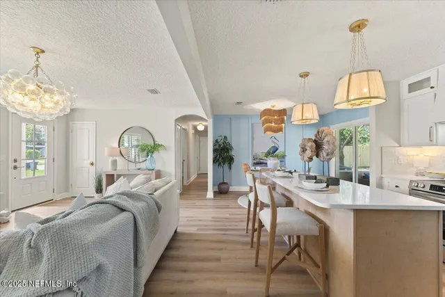 a bedroom with a bed and a chair