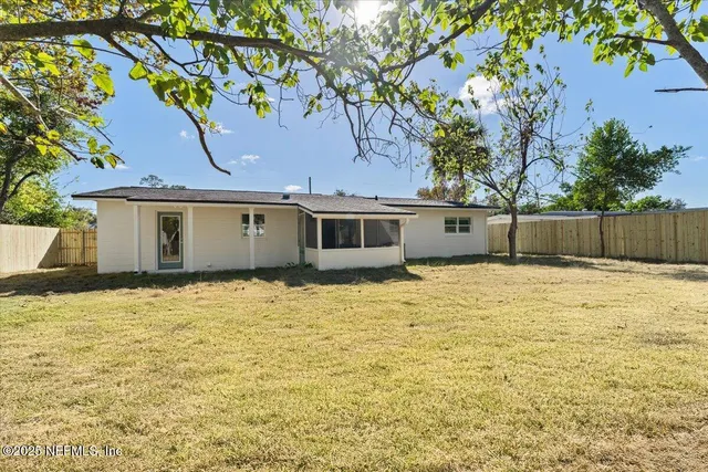 an aerial view of residential houses with city view