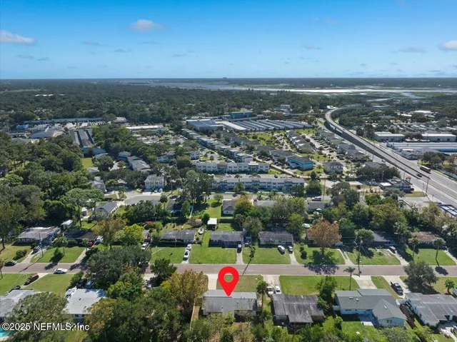 a view of a patio with table and chairs and potted plants