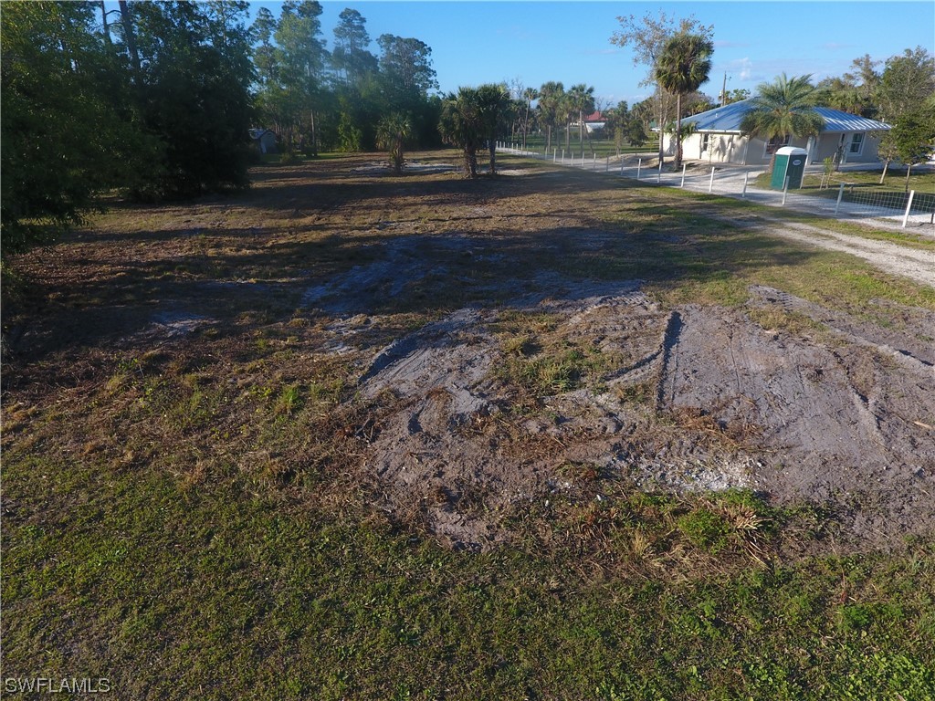 3860 Ellis Road Fort Myers, FL 33905 - Photo 3 of 18 a view of dirt yard with green space