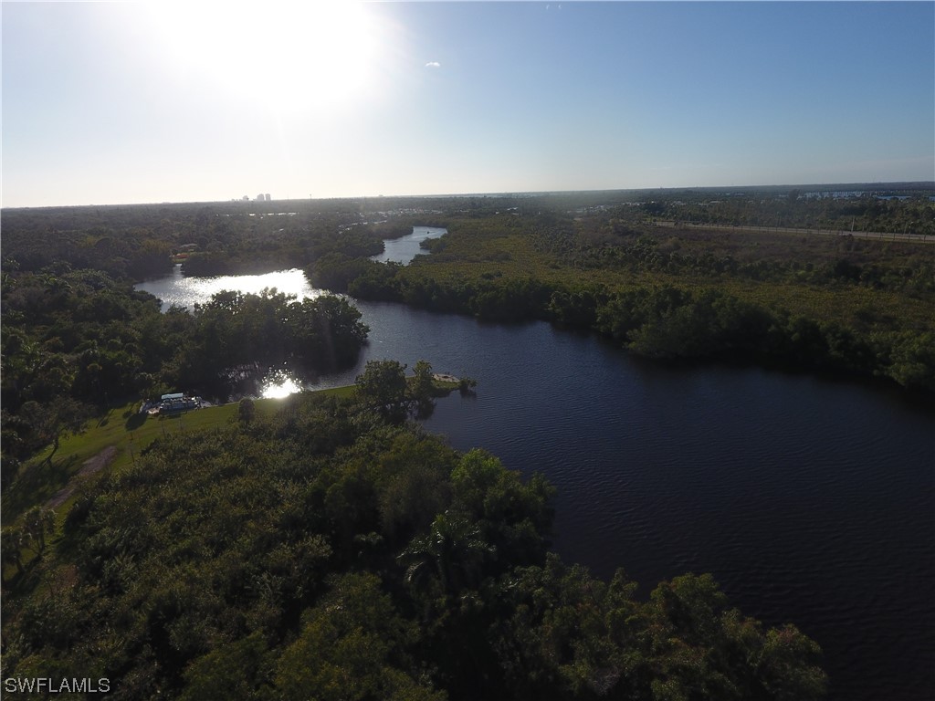 3860 Ellis Road Fort Myers, FL 33905 - Photo 8 of 18 an aerial view of a house with a yard