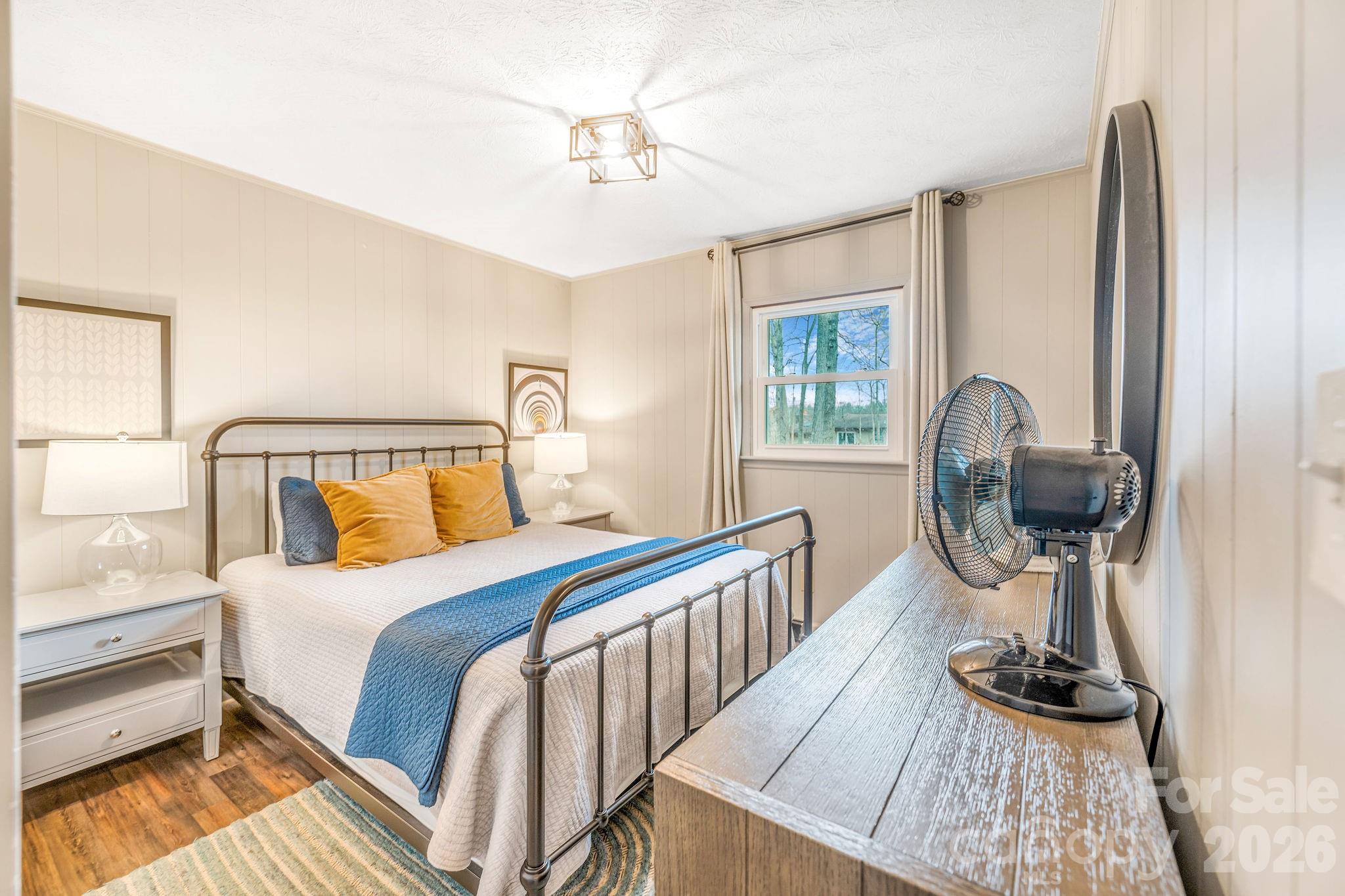 96 Oak Hill Road Candler, NC 28715 - Photo 16 of 41 a bedroom with bed and a window