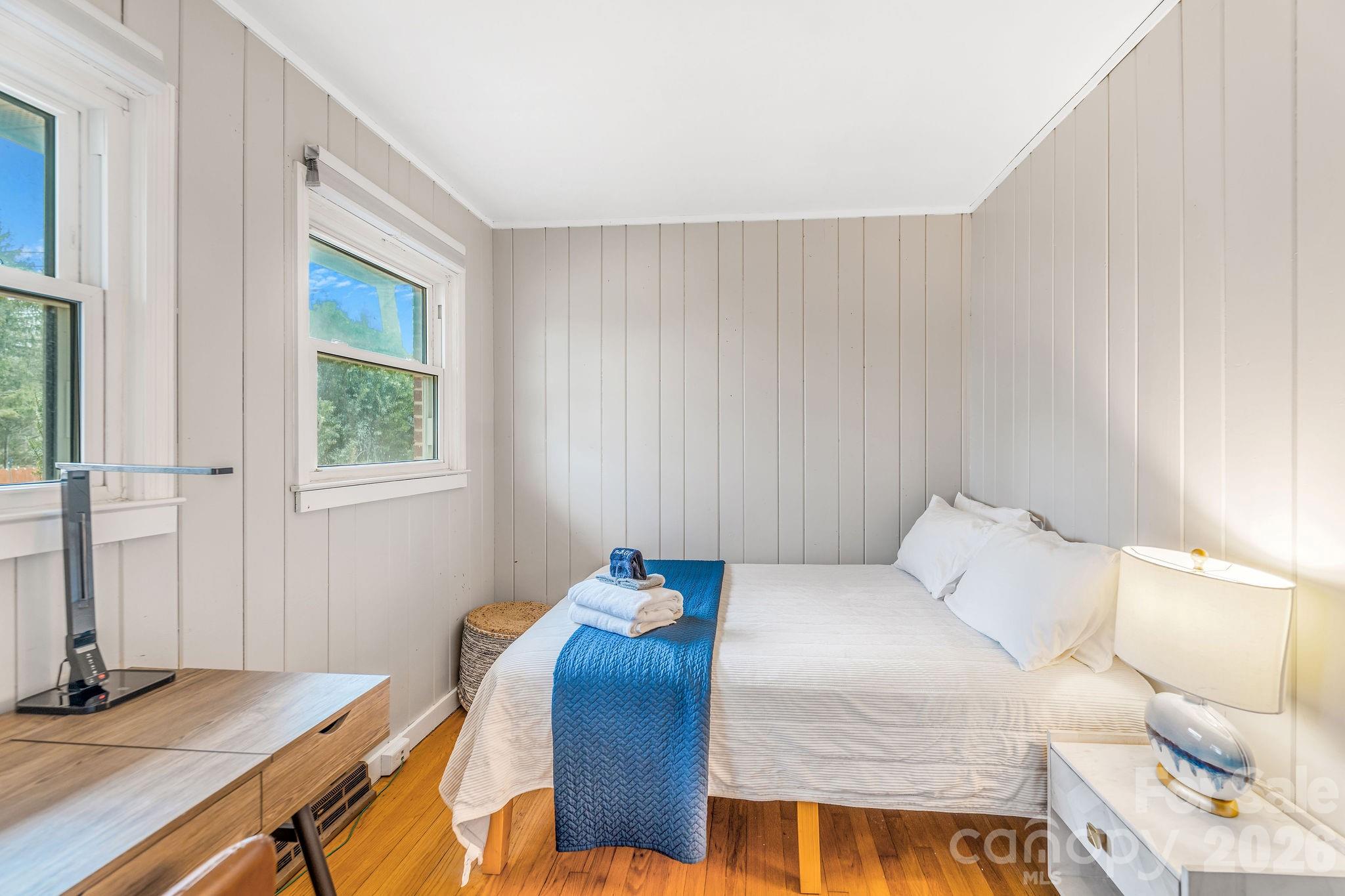 96 Oak Hill Road Candler, NC 28715 - Photo 20 of 41 a bedroom with a bed and a window