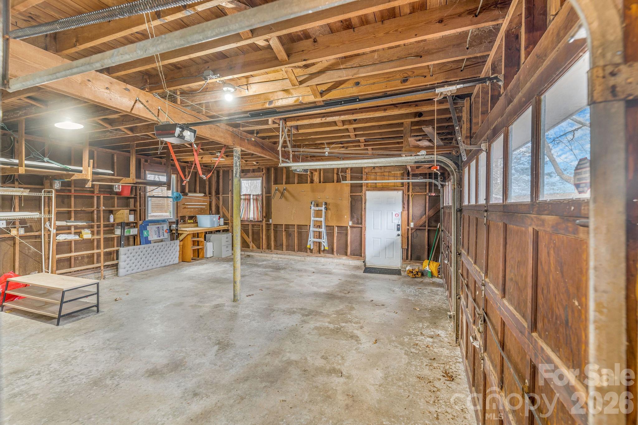 96 Oak Hill Road Candler, NC 28715 - Photo 26 of 41 a view of empty room with wooden ceiling