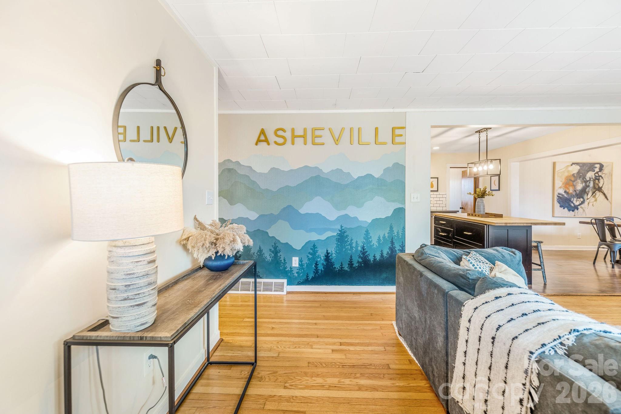 96 Oak Hill Road Candler, NC 28715 - Photo 3 of 41 a bedroom with furniture and a bathtub