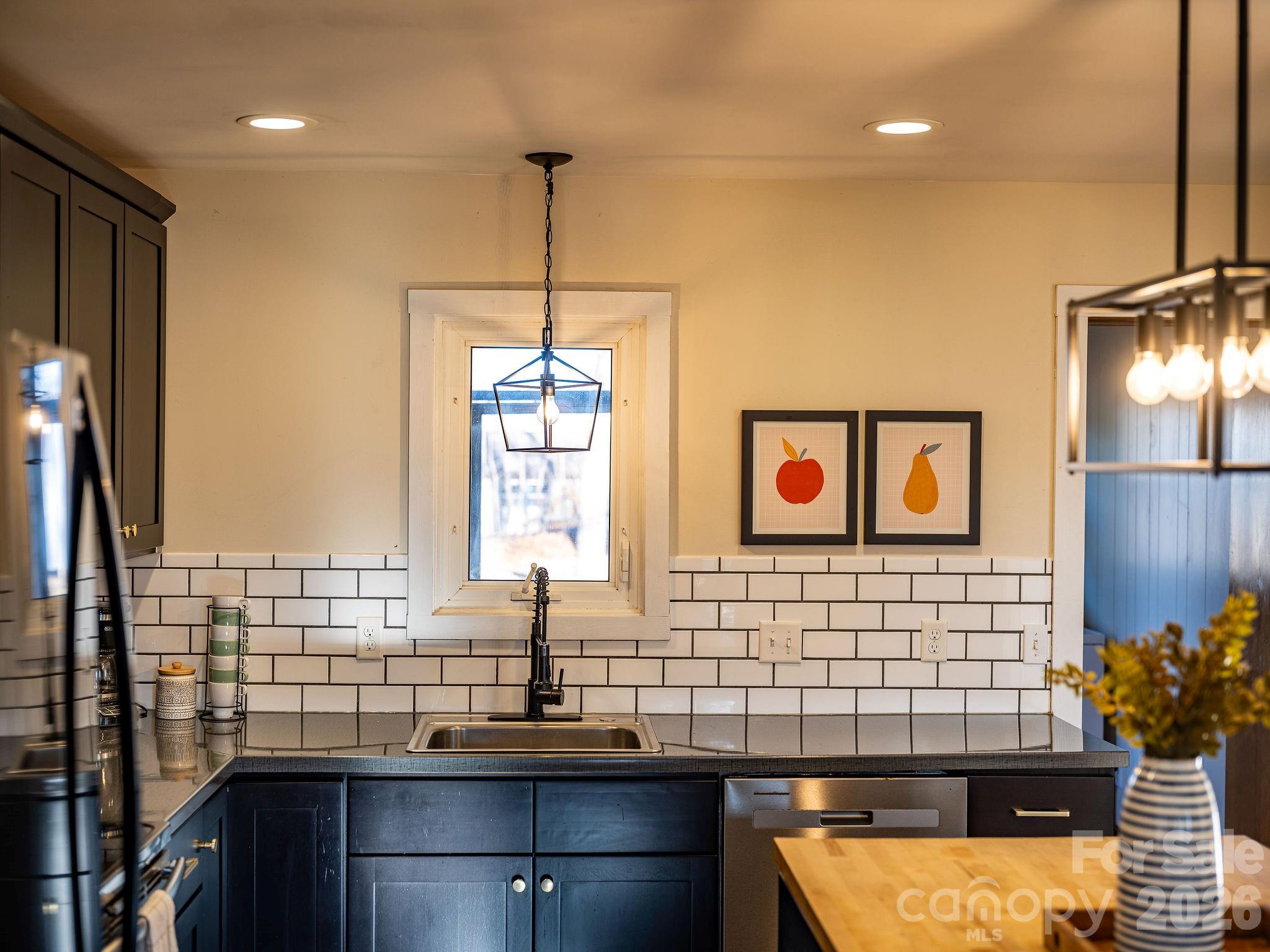 96 Oak Hill Road Candler, NC 28715 - Photo 4 of 41 a bathroom with a sink a mirror and shower
