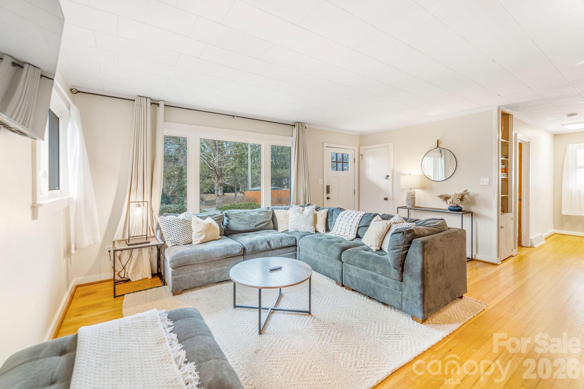 96 Oak Hill Road Candler, NC 28715 - Photo 5 of 41 a living room with furniture and a large window