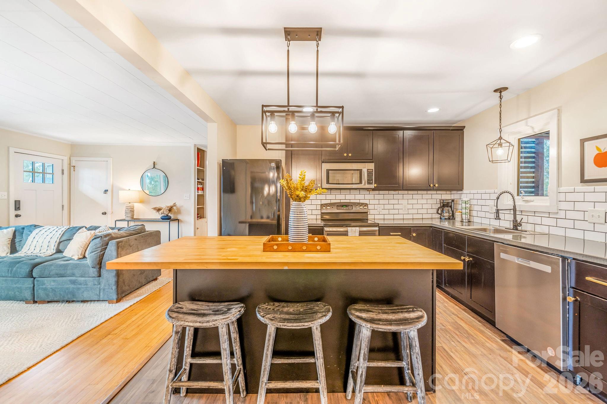 96 Oak Hill Road Candler, NC 28715 - Photo 9 of 41 a large kitchen with a table and chairs