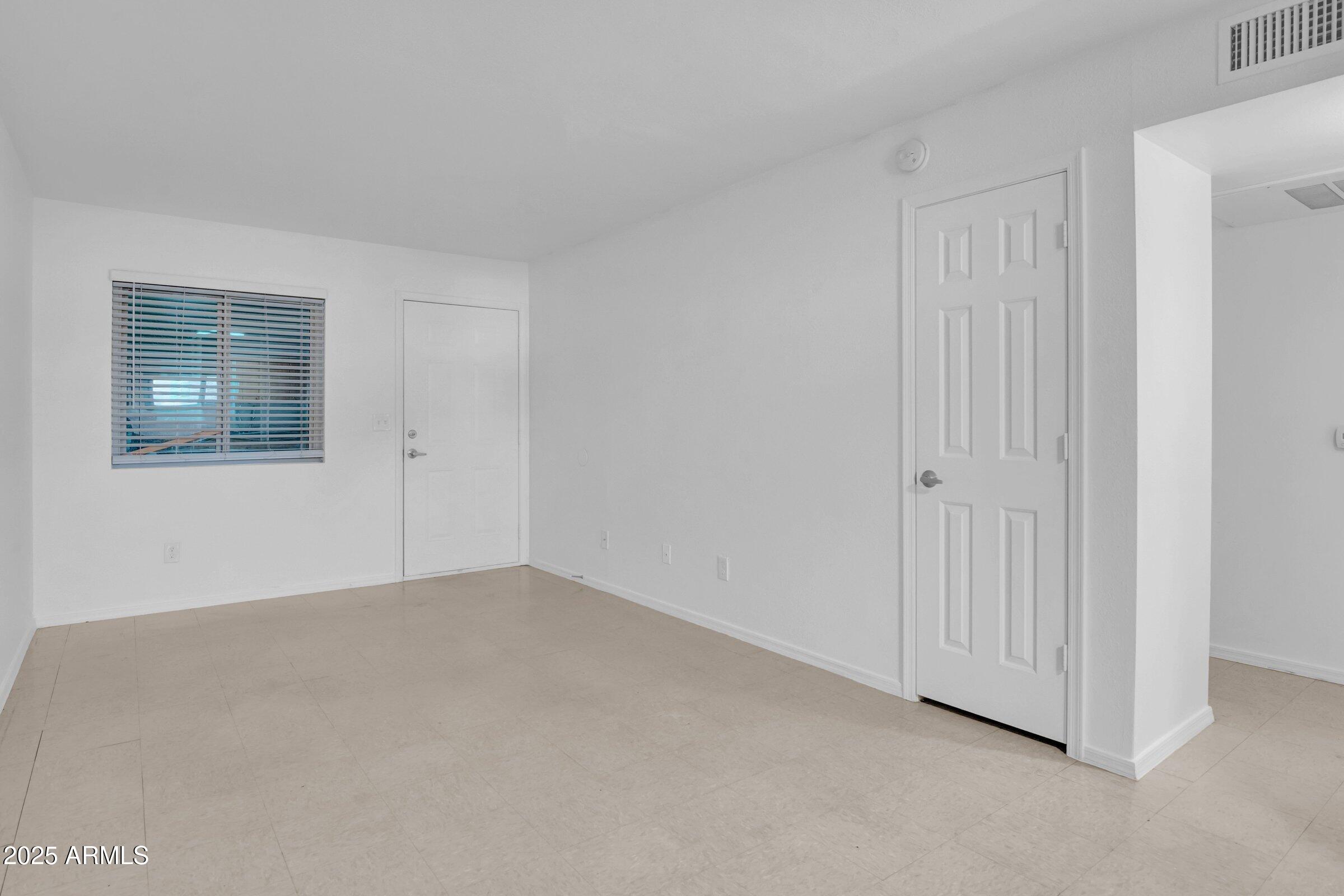2234 West Hazelwood Street Phoenix, AZ 85015 - Photo 12 of 22 a view of an empty room with closet area