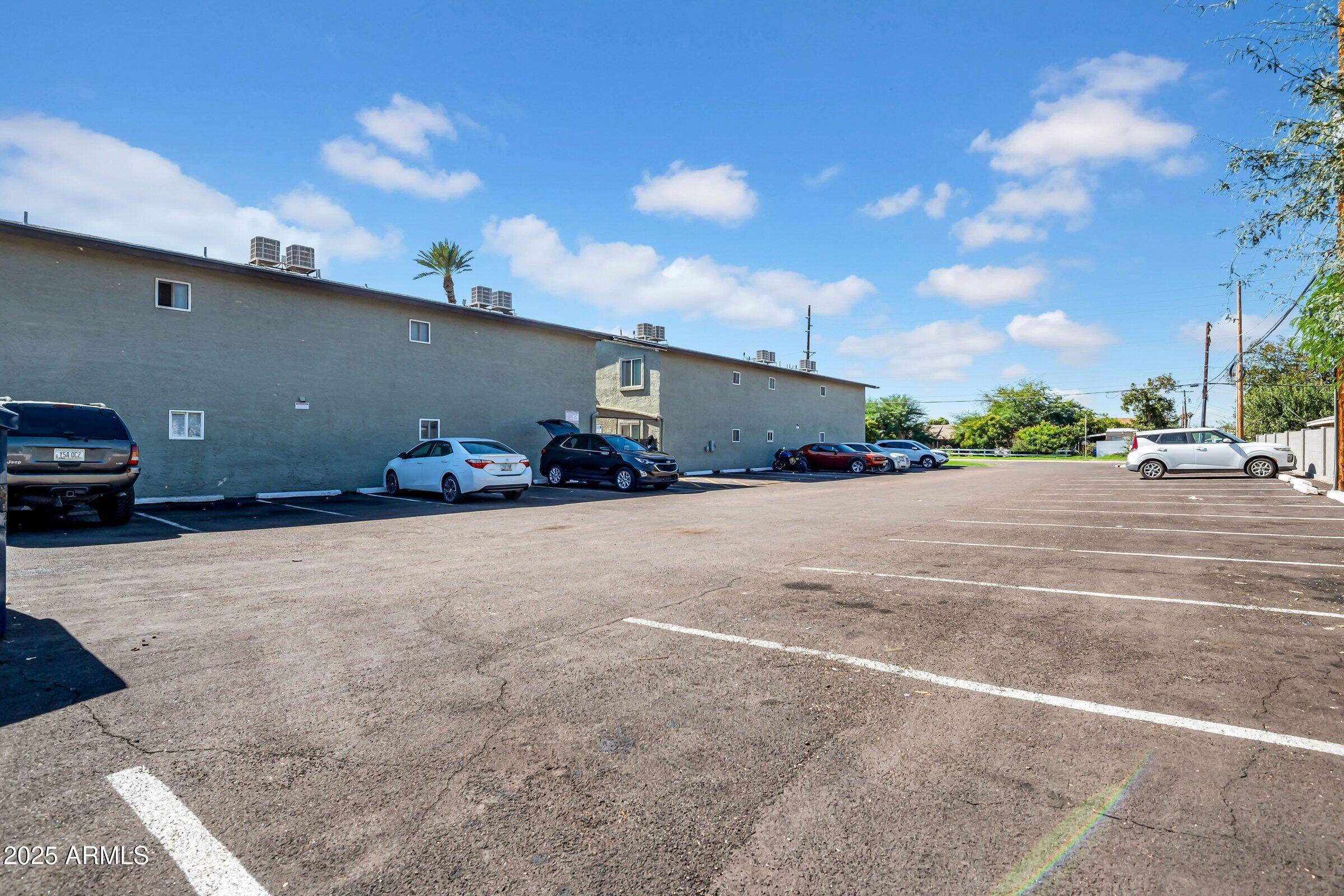 2234 West Hazelwood Street Phoenix, AZ 85015 - Photo 6 of 22 a car parked on the side of the road