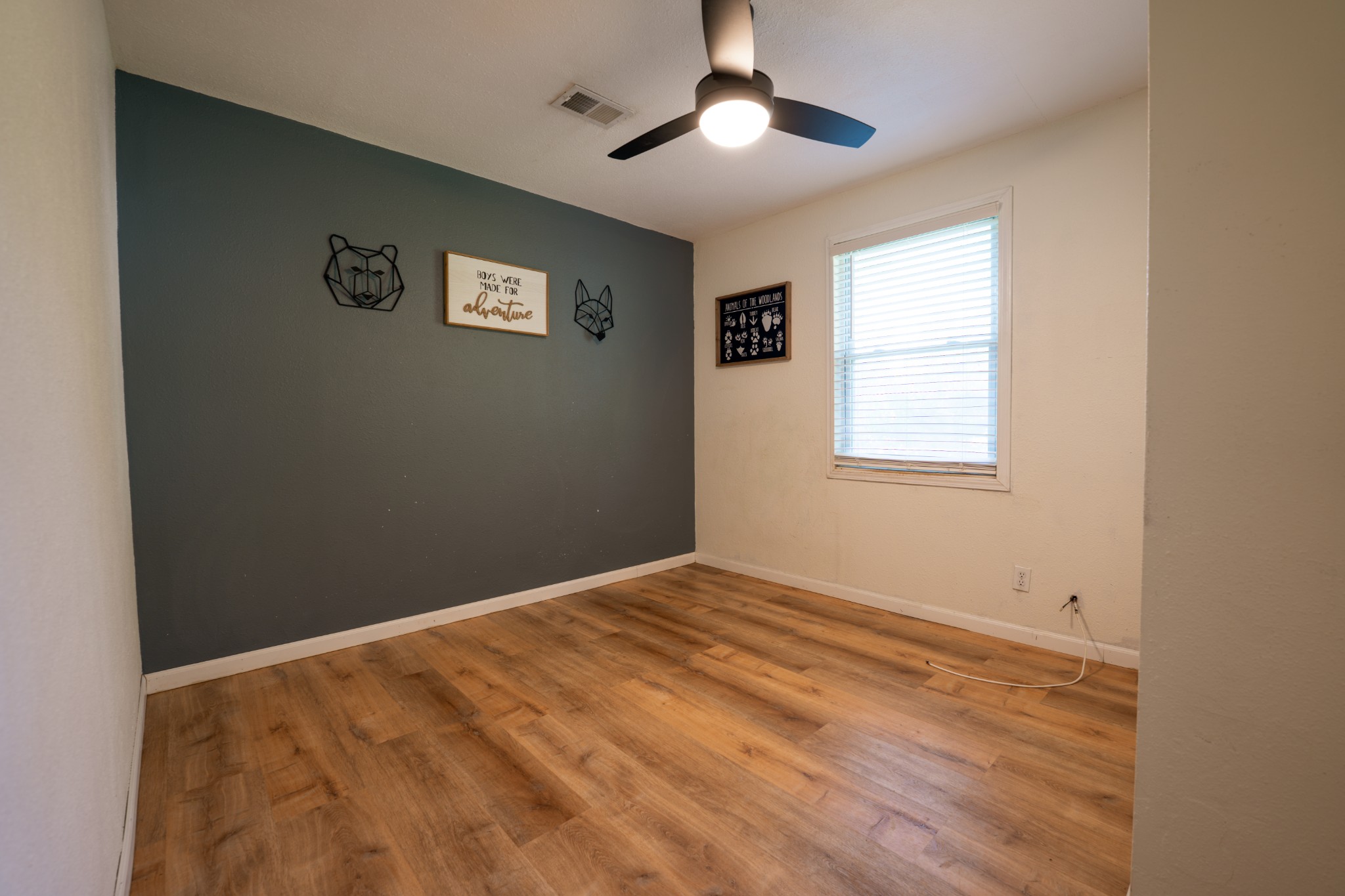 8247 Pinewood Road Nunnelly, TN 37137 - Photo 8 of 14 a view of an empty room with a window