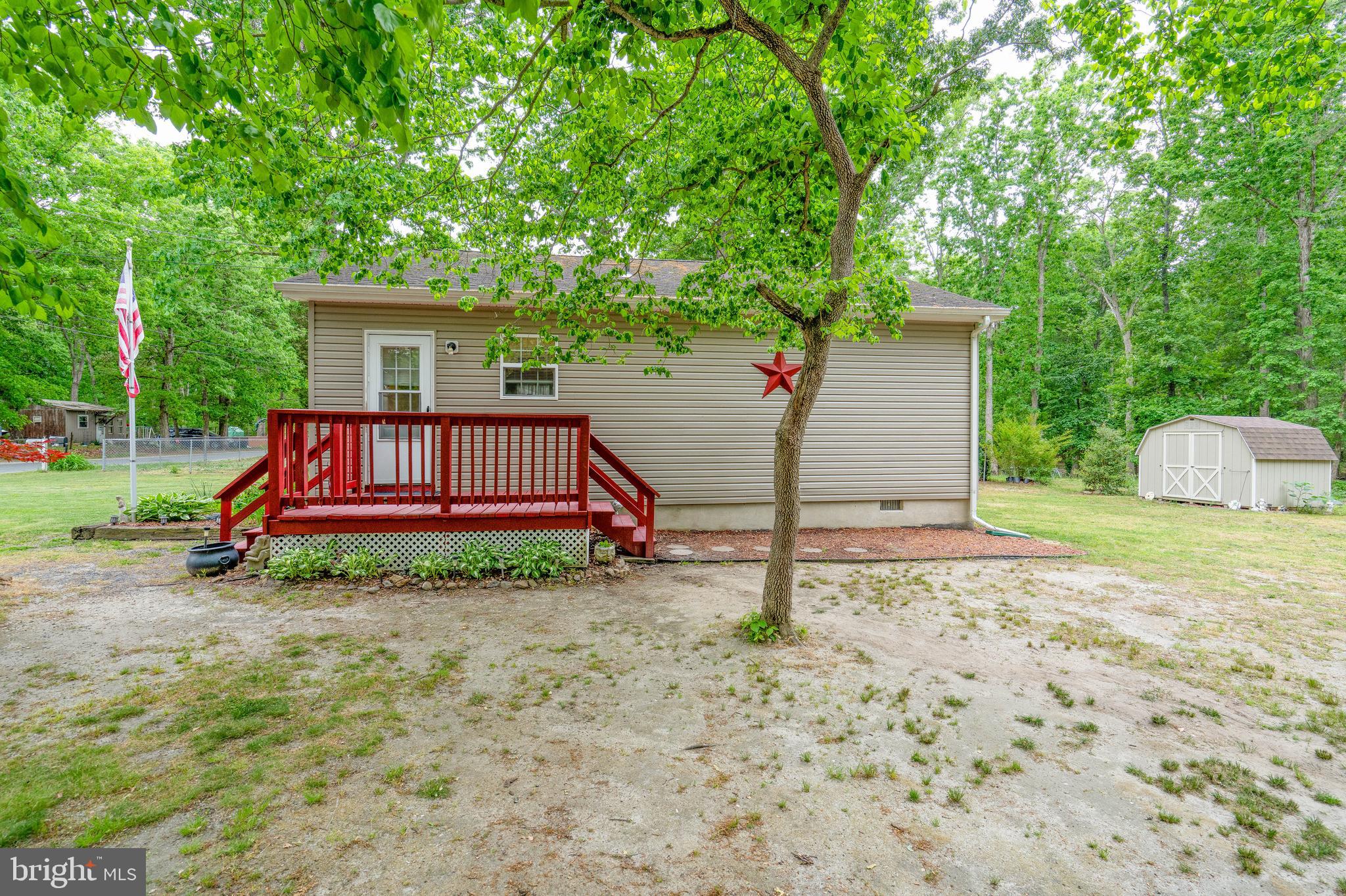 315 Beech Road Millville, NJ 08332 - Photo 3 of 21 a view of backyard of house and garden