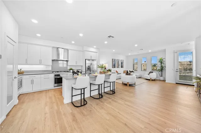 a kitchen with a refrigerator and microwave