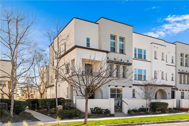 a view of a white building among the street