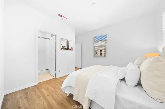 a bathroom with a bathtub sink and mirror