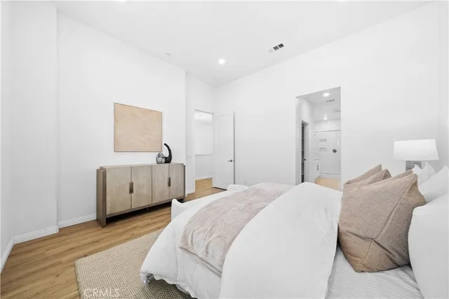 a bathroom with a walk in closet and a shower