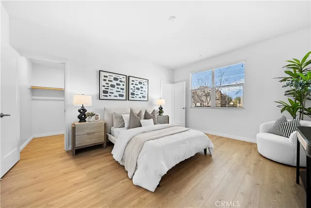 a bedroom with bed and window