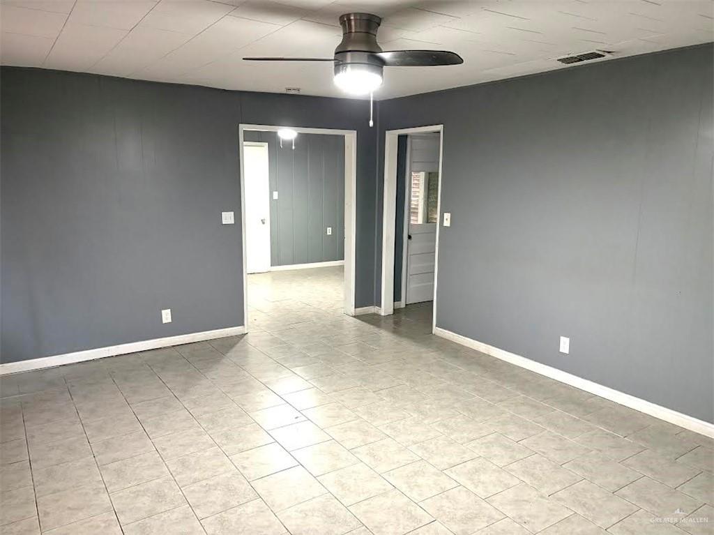 1317 South B Street Harlingen, TX 78550 - Photo 2 of 10 wooden floor in an empty room