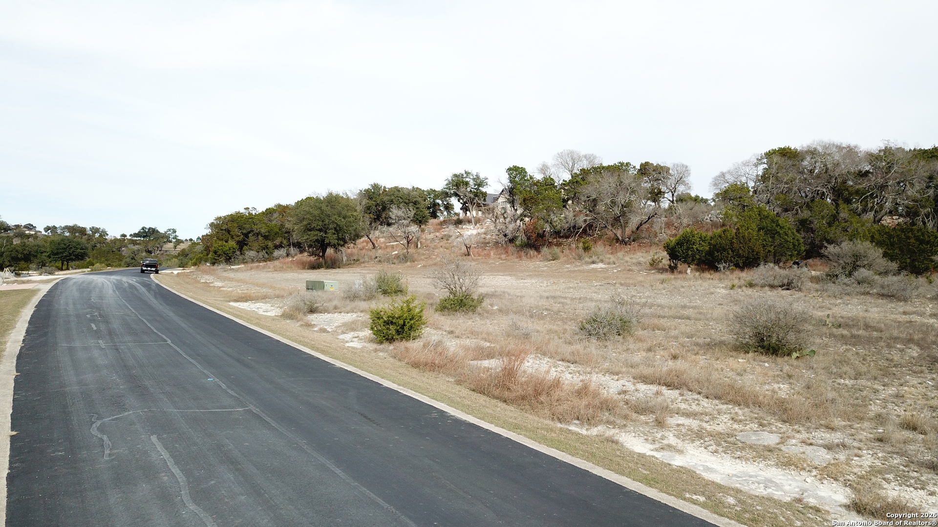 335 Arthur Court Spring Branch, TX 78070 - Photo 13 of 18 a view of a dry yard with wooden fence