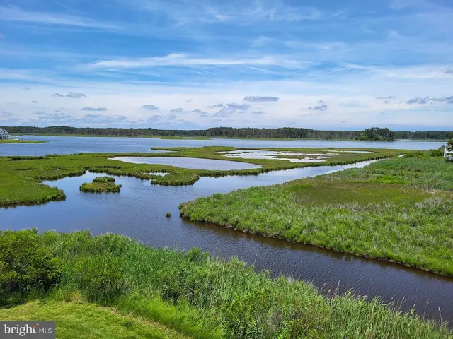 a view of a swimming pool with an outdoor space and seating area