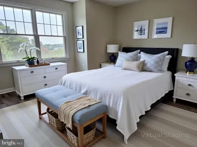 a view of a room with wooden floor ceiling fan and windows