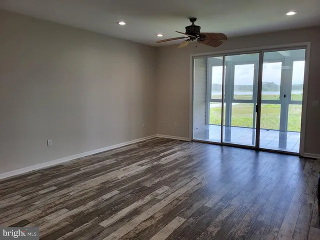 a spacious bedroom with a bed and a couch