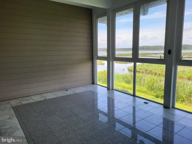 a view of a room with a large window