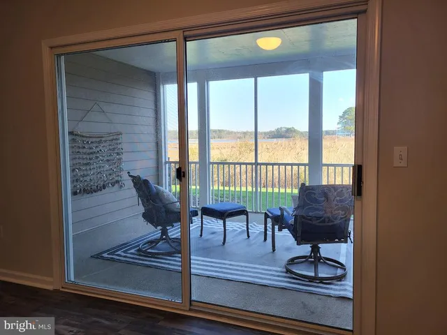 an aerial view of residential houses with outdoor space and swimming pool