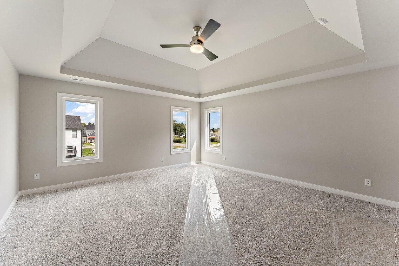 3090 West 105th Avenue Crown Point, IN 46307 - Photo 15 of 22 an empty room with windows and ceiling fan