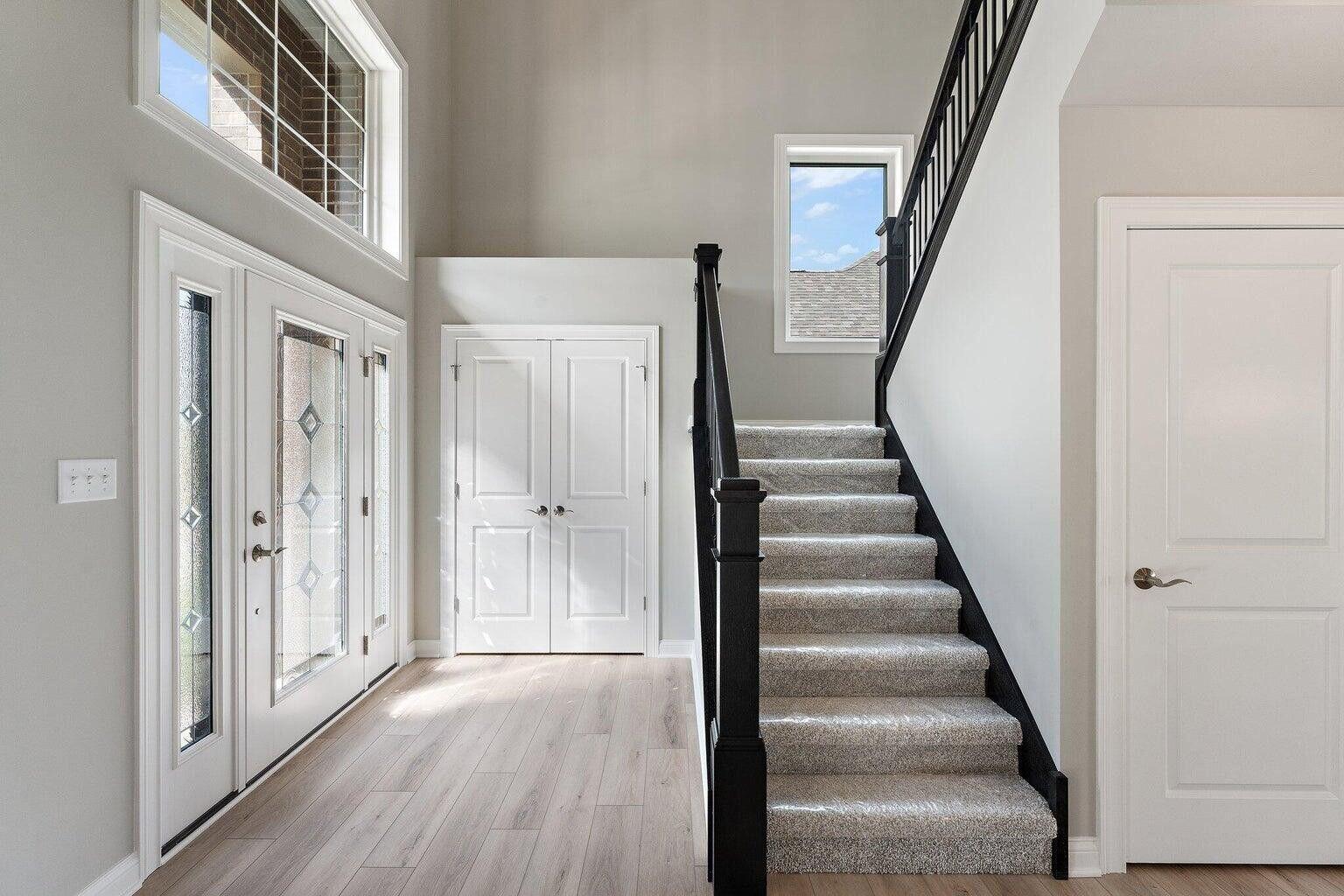 3090 West 105th Avenue Crown Point, IN 46307 - Photo 5 of 22 a view of an entryway with wooden floor