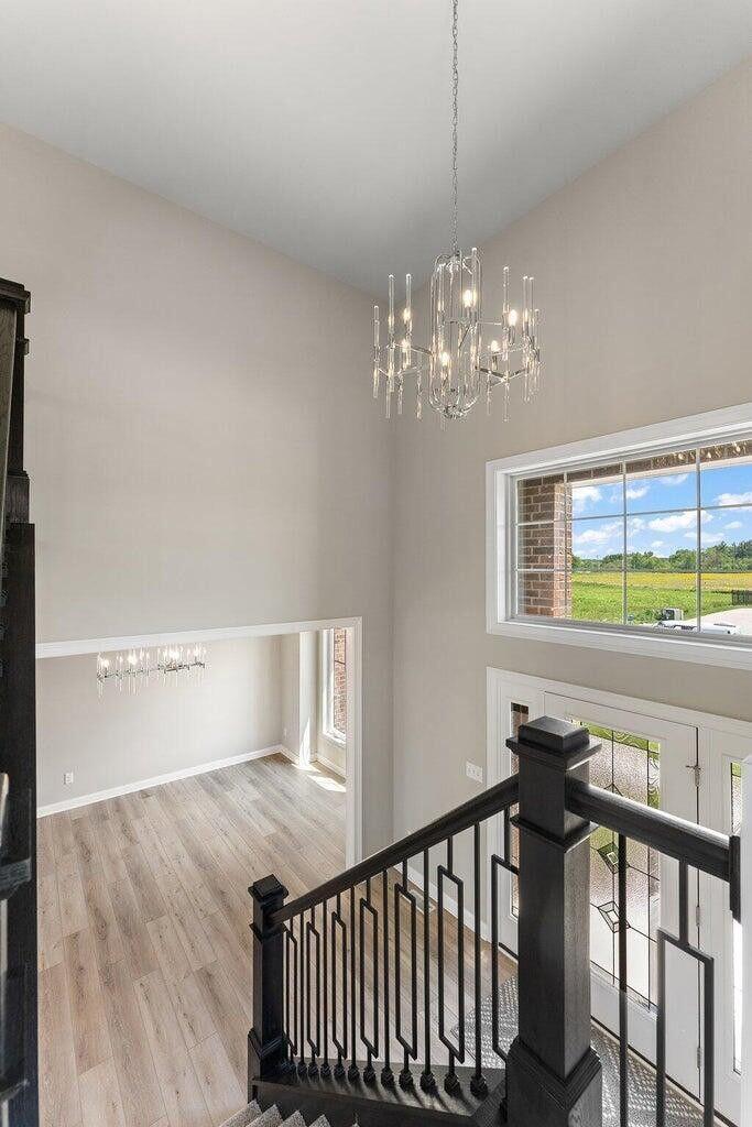 3090 West 105th Avenue Crown Point, IN 46307 - Photo 7 of 22 a view of a dining room with furniture and chandelier