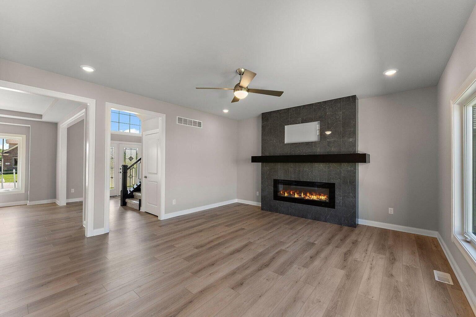 3090 West 105th Avenue Crown Point, IN 46307 - Photo 8 of 22 a living room with furniture and a fireplace