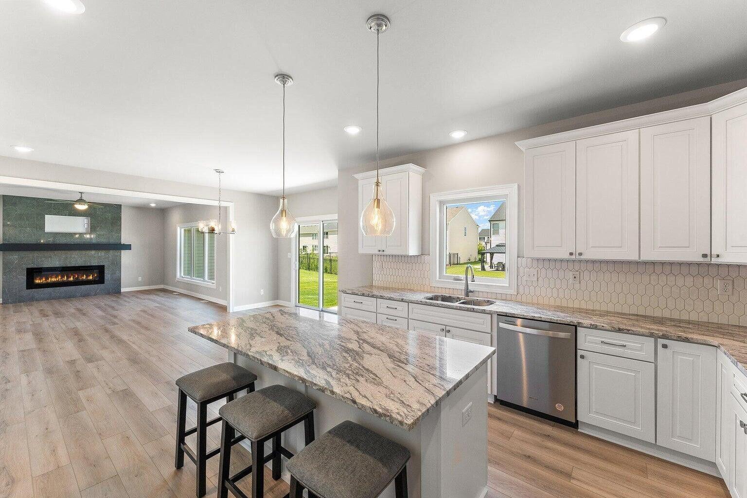 3090 West 105th Avenue Crown Point, IN 46307 - Photo 10 of 22 a kitchen with sink cabinets and wooden floor