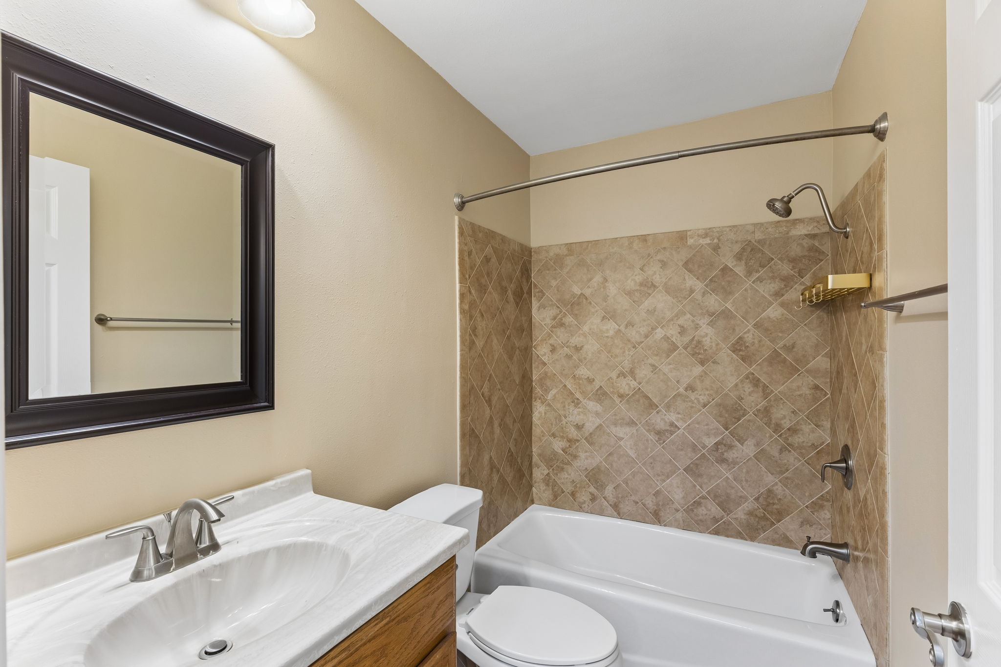 8340 Fathom Circle, Unit 103 Austin, TX 78750 - Photo 23 of 30 a bathroom with a sink toilet and shower