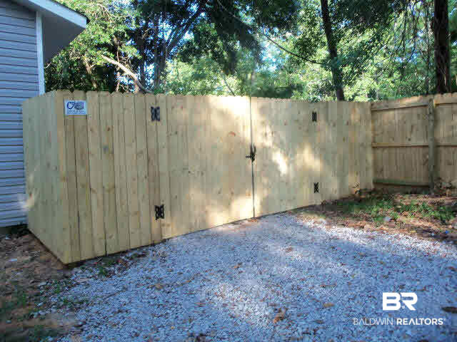 18568 South Greeno Road Fairhope, AL 36532 - Photo 21 of 22 LARGE DOUBLE GATE AT FRONT OF FENCED YARD FOR EASY ACCESS TO BACK.