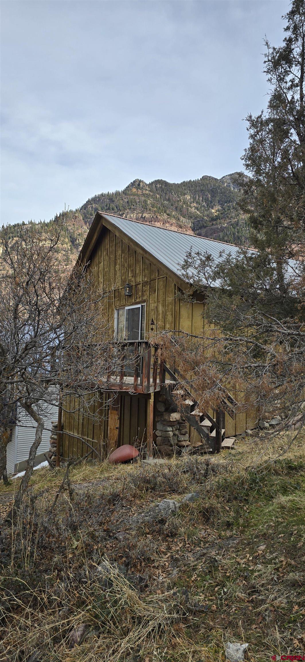 206 4th Street Ouray, CO 81427 - Photo 16 of 18 a view of a house with a mountain
