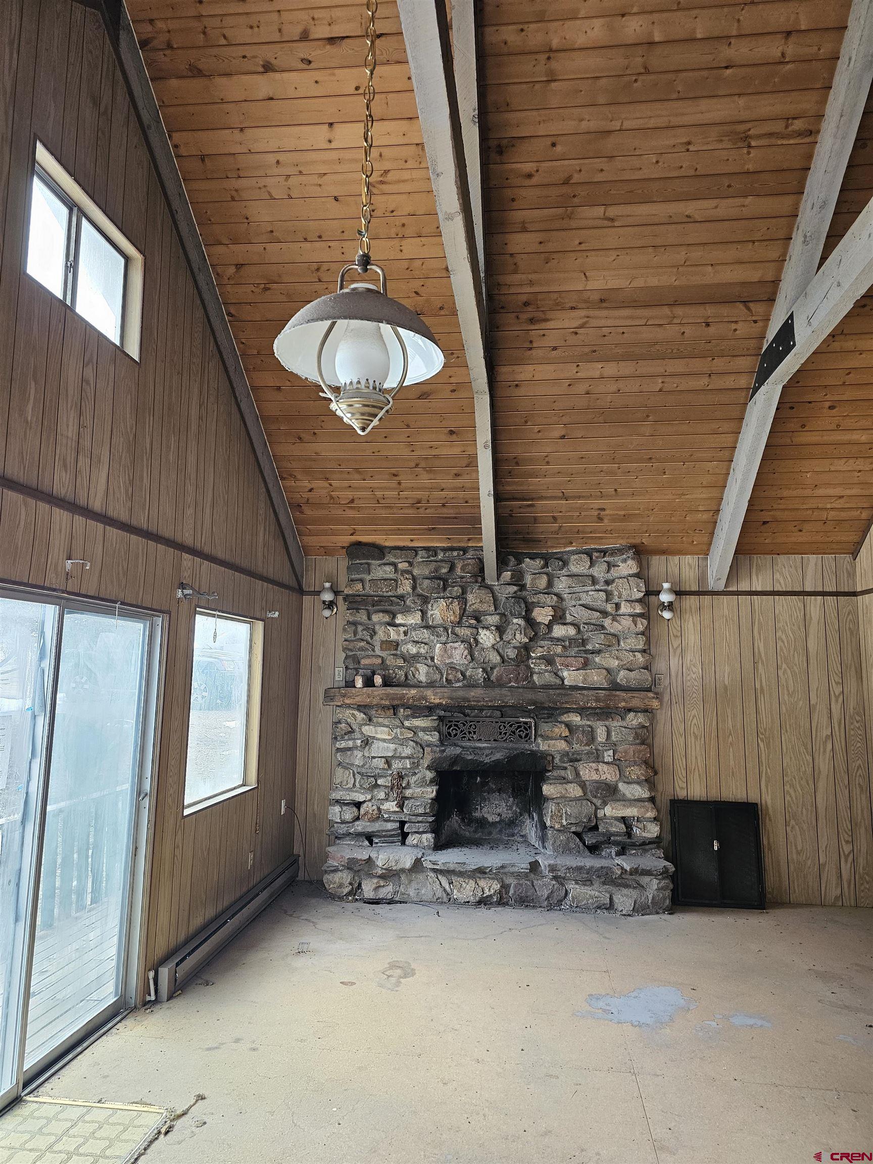 206 4th Street Ouray, CO 81427 - Photo 5 of 18 a view of fireplace and window