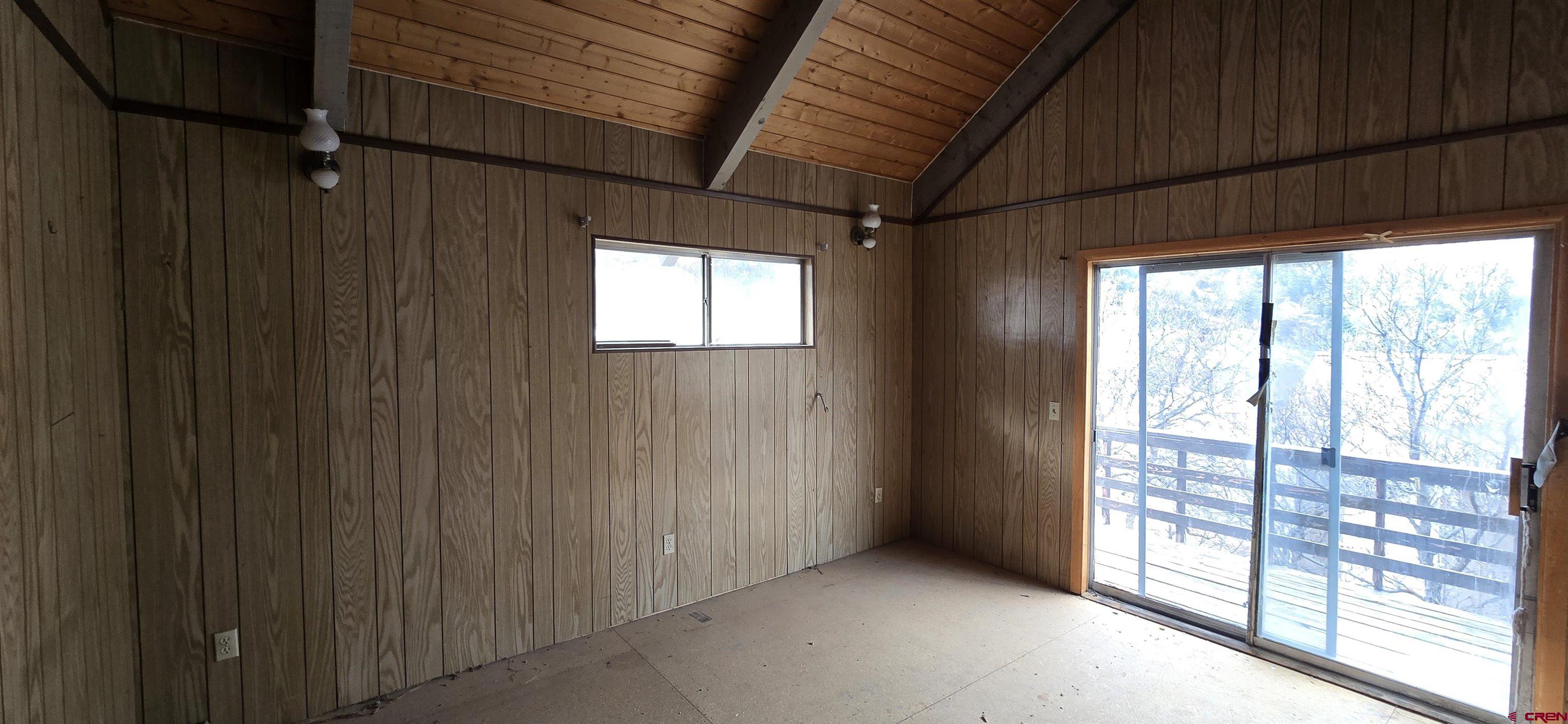 206 4th Street Ouray, CO 81427 - Photo 8 of 18 a view of an empty room with windows